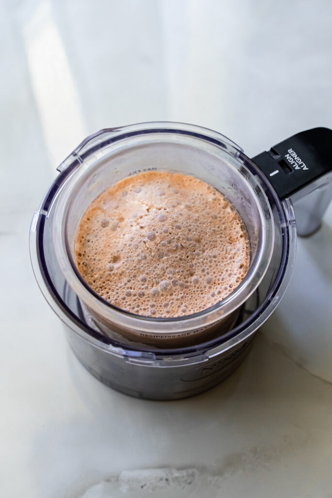 frozen liquid in a ninja creami pint.