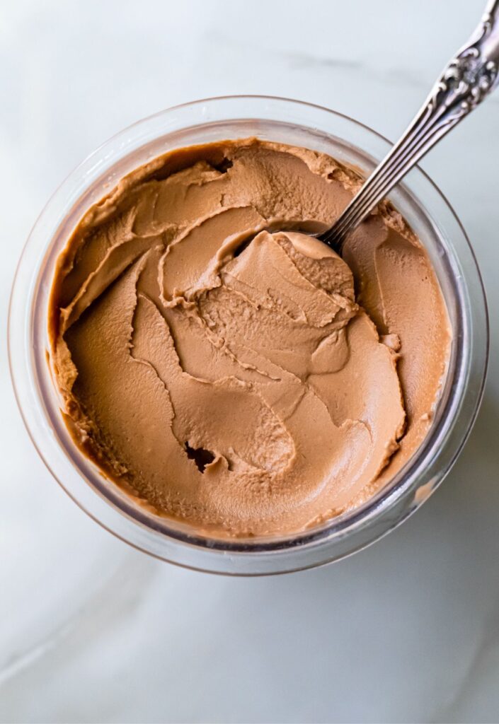 chocolate ice cream with a spoon.