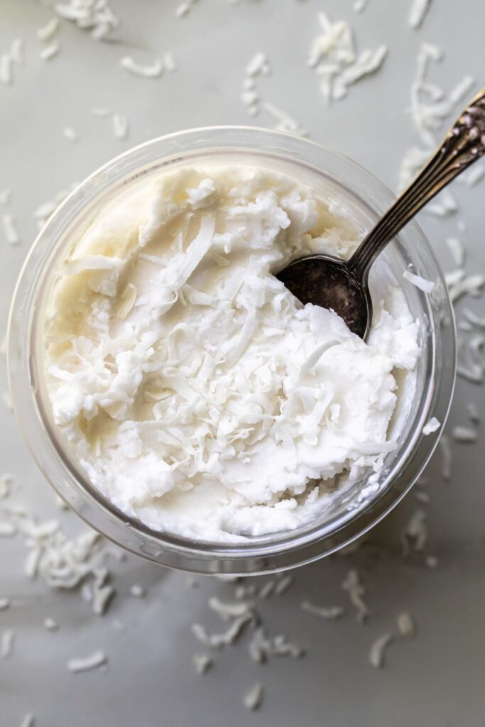 coconut ice cream in a pint with a spoon.