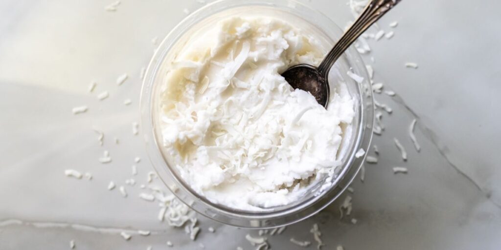 coconut ice cream in a pint with a spoon.