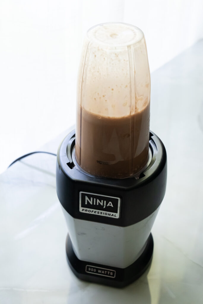 ninja blender with chocolate liquid.