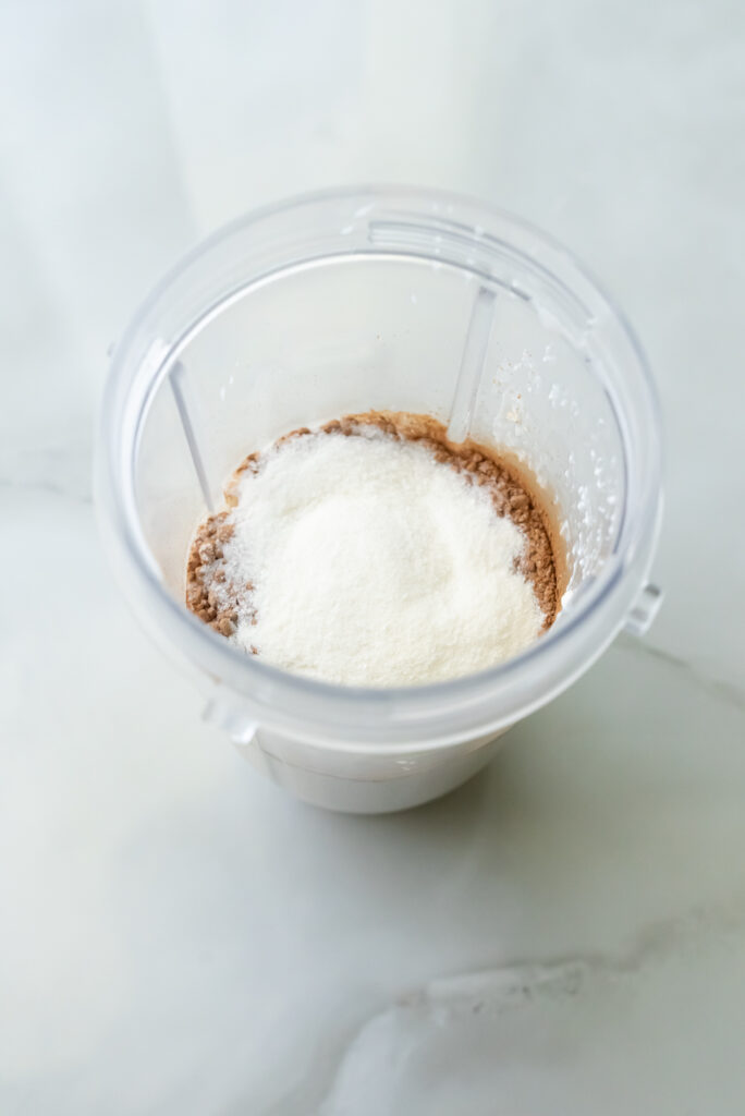 clear cup with liquid and powder.