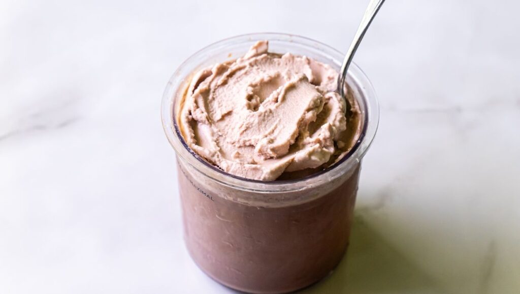 high protein chocolate ice cream with a spoon.