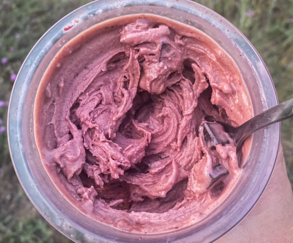 cherry ice cream with a spoon.