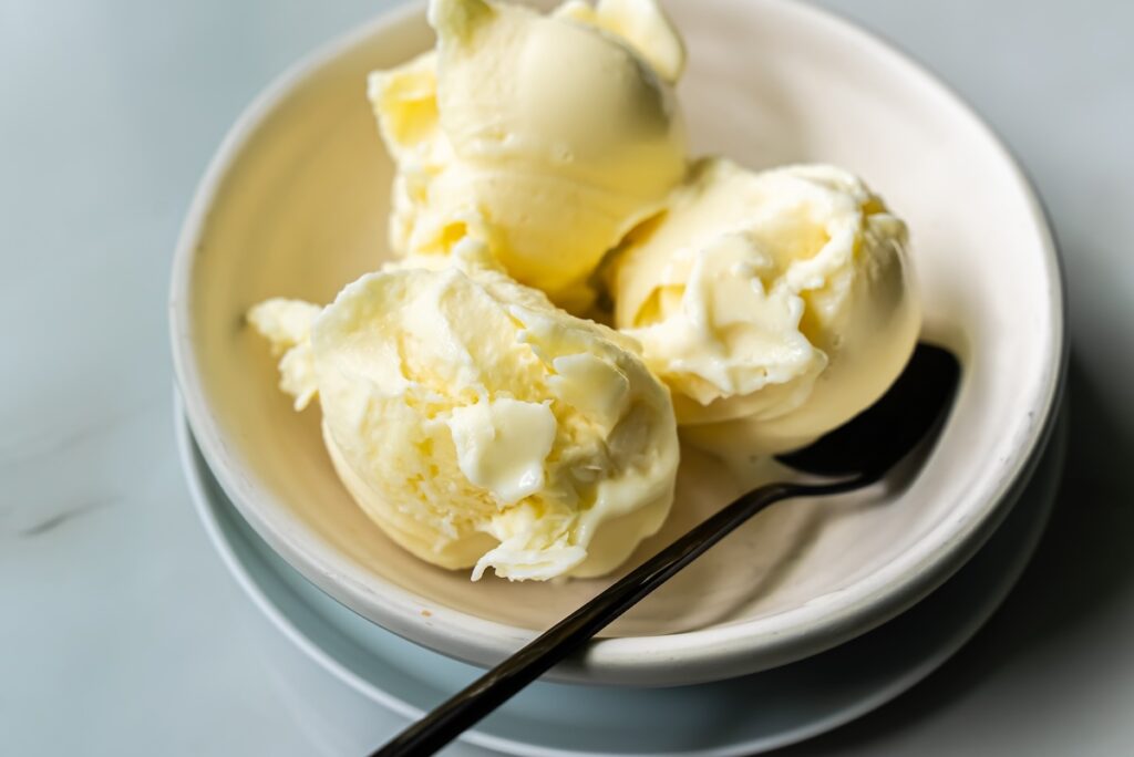 low carb banana protein ice cream in a bowl with a spoon.