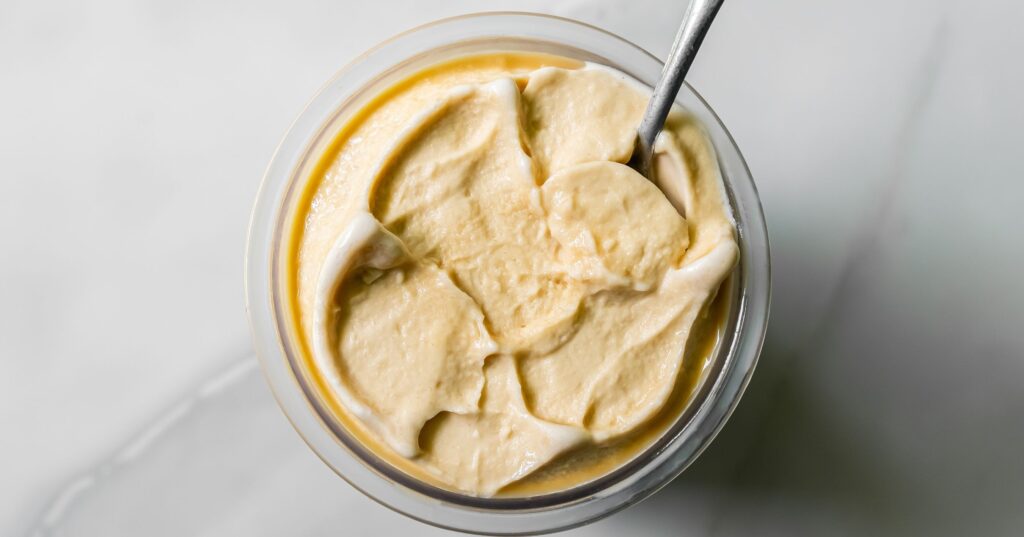 top view of oat milk protein coffee ice cream with a spoon