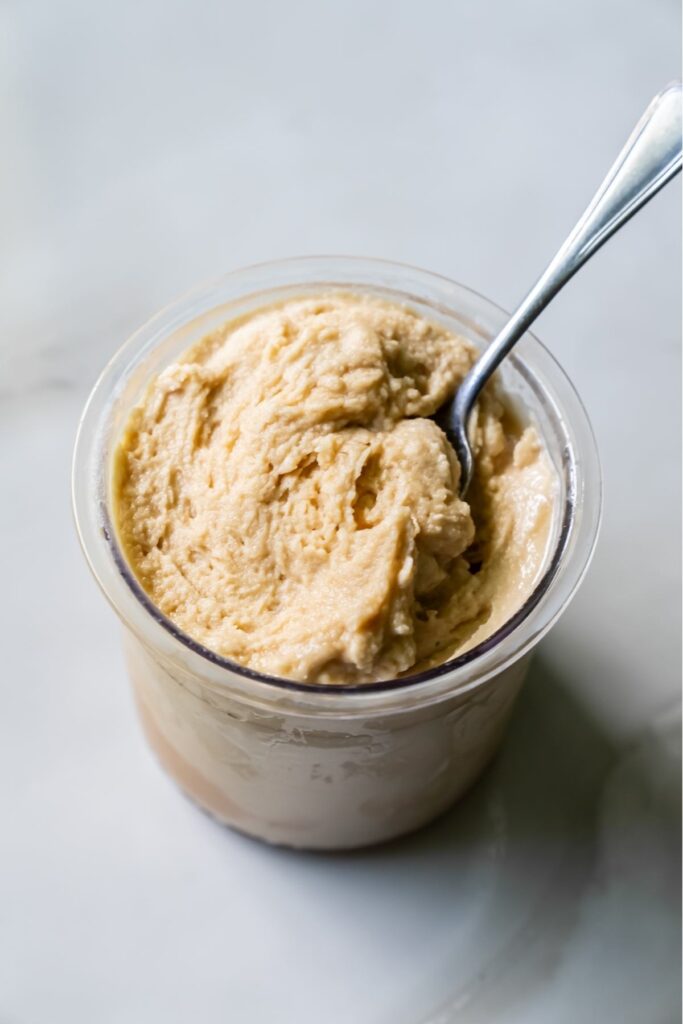 oat milk protein coffee ice cream with a spoon