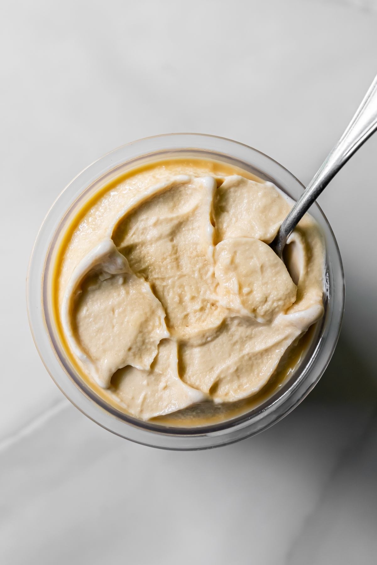 top view of oat milk protein coffee ice cream with a spoon