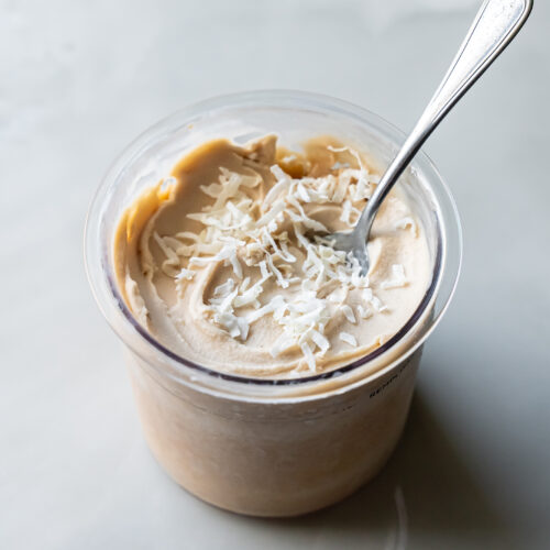 ninja creami pina colada ice cream with a spoon.