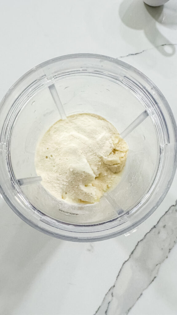 A bowl of Pina Colada protein ice cream ingredients placed on a counter, emphasizing its creamy appearance and delicious tropical essence.