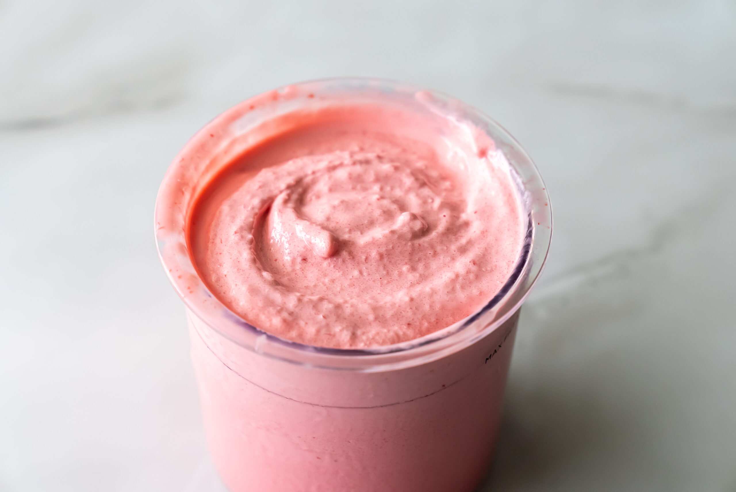 cherry protein ice cream in a pint.