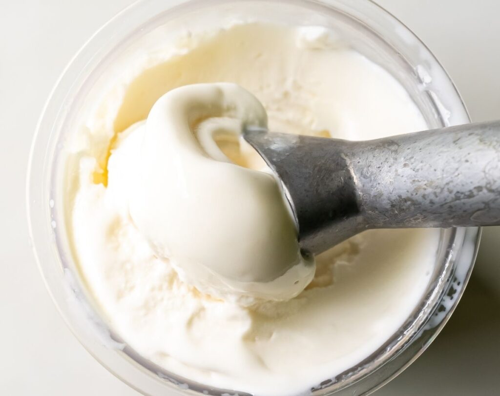 keto coconut protein ice cream with an ice cream scoop.