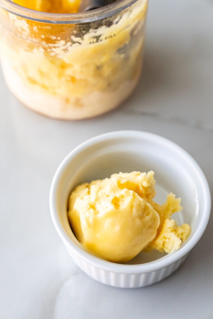 peach sorbet in a white bowl.